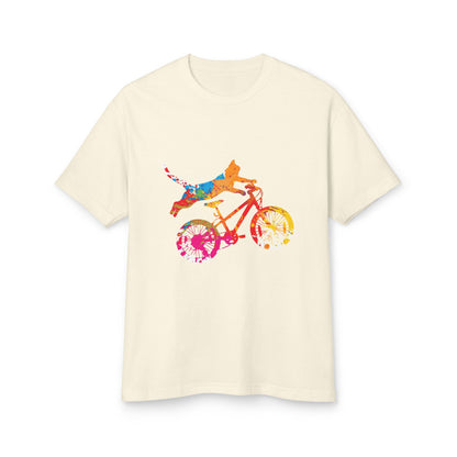 Beige t-shirt with a colorful graphic of a person riding a bike on a white background