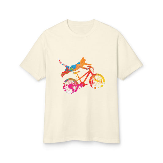 Beige t-shirt with a colorful graphic of a person riding a bike on a white background